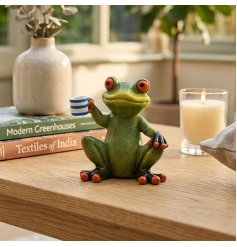 bring a splash of amusement to your living space with this charming seated frog ornament
