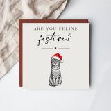Send festive cheer with this charming cat-themed Christmas card