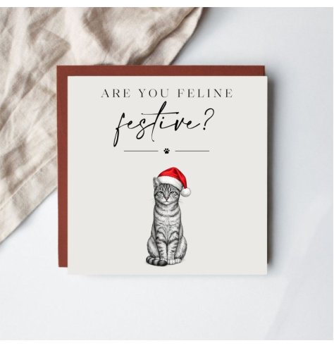 Share festive joy with this adorable cat-themed Christmas card