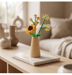 Infuse warmth into your room with this delightful wooden sunflower in an elegant vase