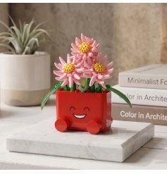 a delightful colourful mini brick planter with cheerful smiley face
