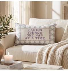Chic square cushion with a charming embroidered message