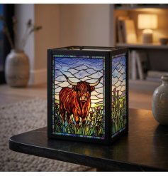 Create a snug ambiance with this delightful stained glass Highland Cow tealight holder
