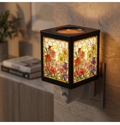 an elegant floral design fragrance warmer with glowing panels