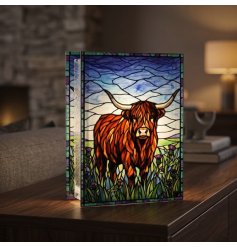 Add a cosy, colourful radiance to your home with this delightful Highland Cow stained glass plaque