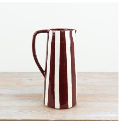 Elegant wine red ceramic jug with fine striped detail, perfect for flowers or as a decorative piece