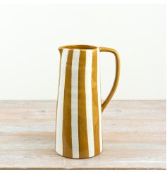 Bring a splash of sunny European elegance into your space with this ochre-striped ceramic jug