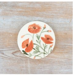 this coaster has a beautiful poppy design 