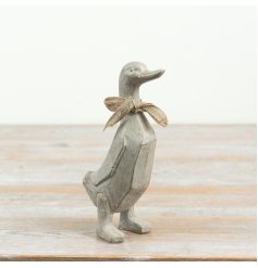 Add a touch of country charm to your space with this standing duck figurine