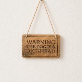 Add a cheeky touch of humour to your home with this amusing novelty dog sign