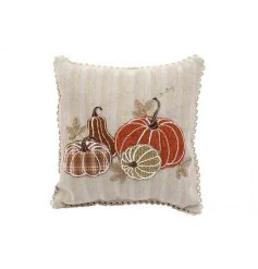 Introduce a snug autumn vibe with this delightful pumpkin-embroidered scatter cushion