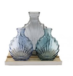 Introduce a gentle, textured splash of colour to your living space with this sea-themed vase ornament