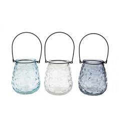 Endearing fish-embossed tealight lantern casting a cosy, maritime ambiance in your home