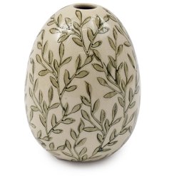 A gently curved bud vase adorned with an intricate green leaf motif