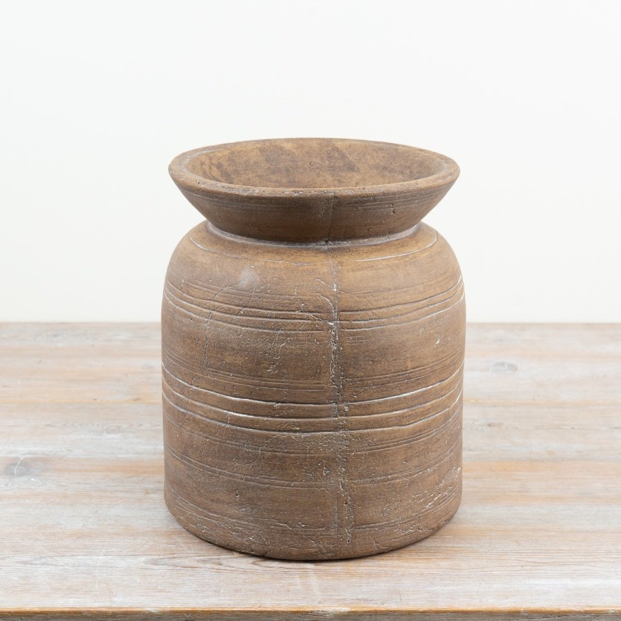 An enchanting rustic earthenware vase with natural earthy appeal