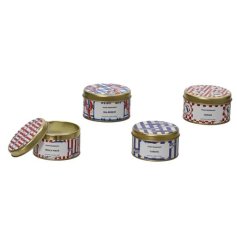 Classic brushed-gold travel tins make these coastal candles a stylish must-have