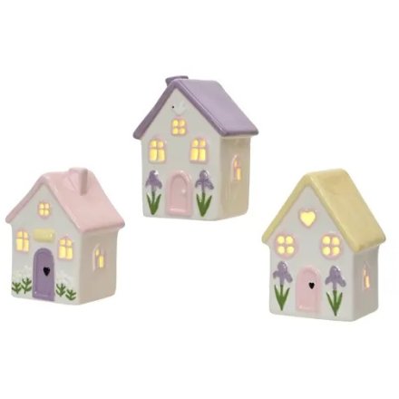 a charming light up house perfect for spring 