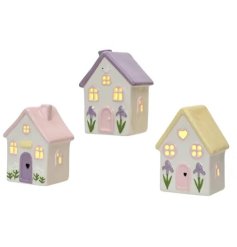 a charming light up house perfect for spring 