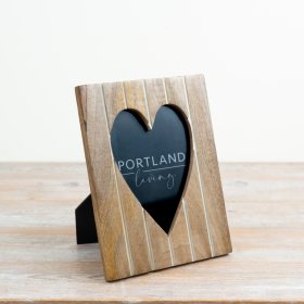 Display your cherished memories elegantly with this delightful heart frame