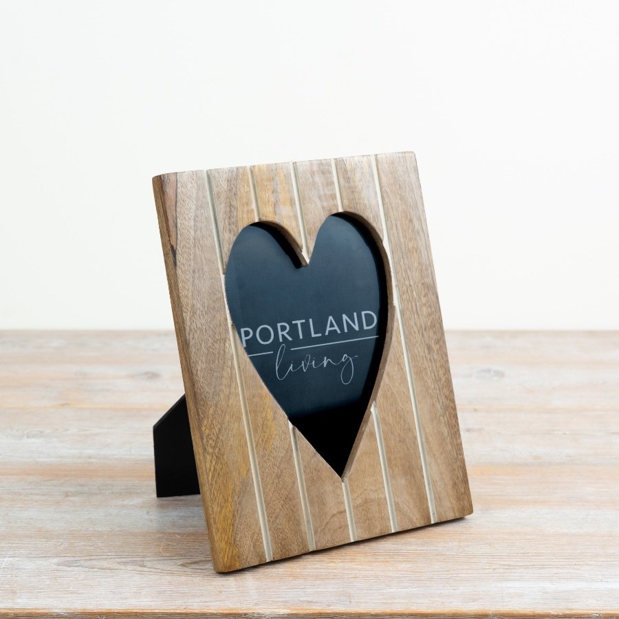 Display your cherished memories elegantly with this delightful heart frame