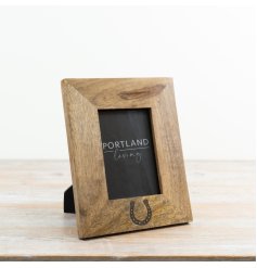 a charming freestanding horseshoe frame with a rustic finish