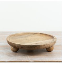 A stylish stand for candles and blooms on your coffee table or a chic vanity display