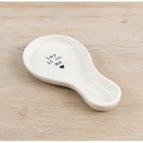 Enhance your kitchen surfaces with this stylish white ceramic spoon rest