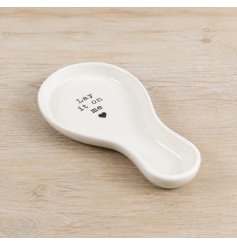 Upgrade your kitchen countertops with this elegant white ceramic spoon rest