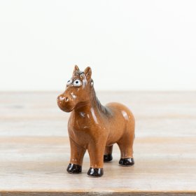 a delightful glazed horse with large, playful eyes