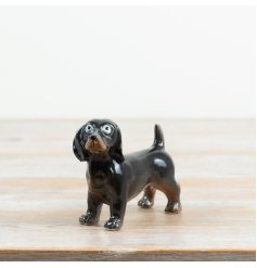a charming glazed ceramic dog with wide eyes 