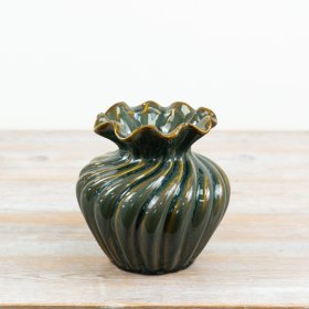 Add a distinctive touch to classic or modern interiors with this elegant green fluted vase