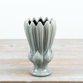 an elegant urn-style vase in soft sage green