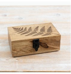 an elegant wooden trinket box featuring a detailed tree embossing