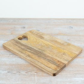 A beautiful serving board finished with a charming heart-shaped cut-out