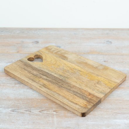 a stunning serving board with a heart cut out shape 