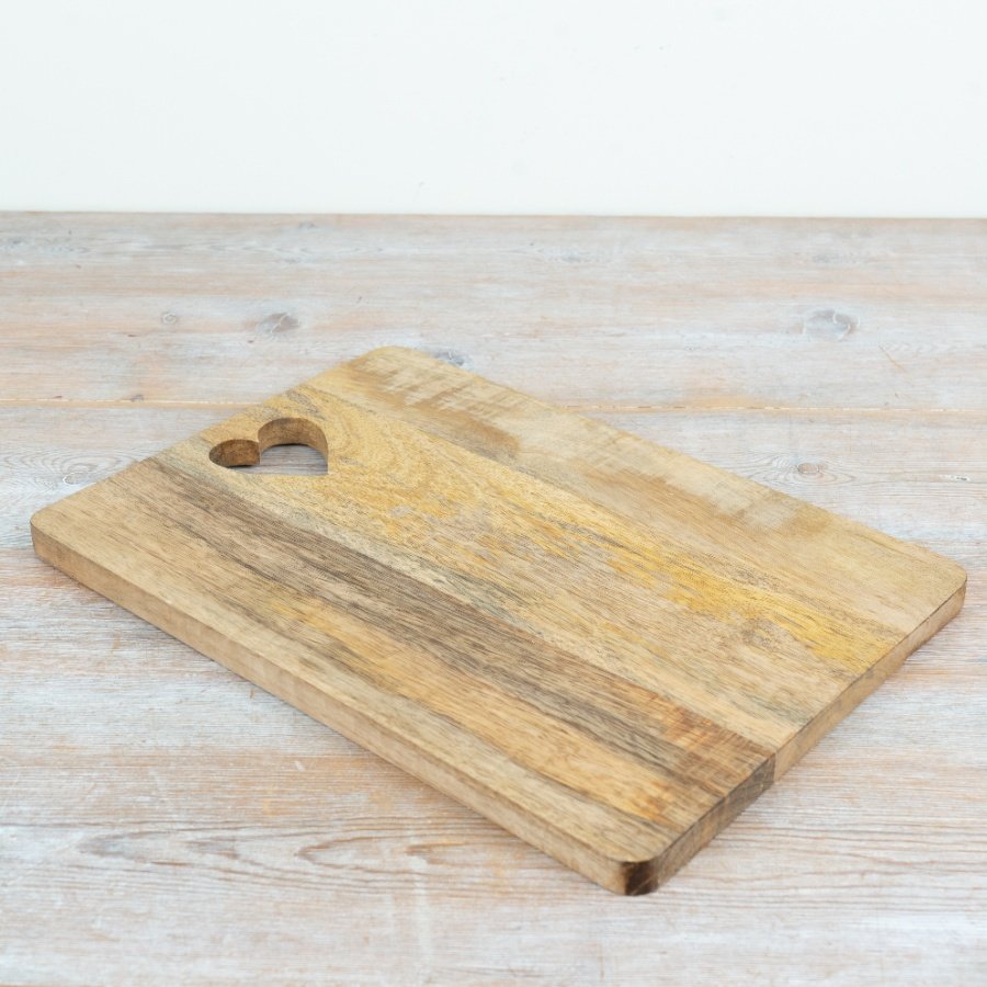 A beautiful serving board finished with a charming heart-shaped cut-out