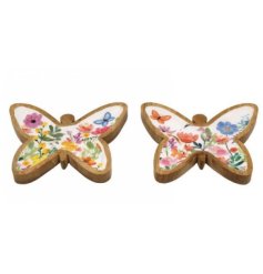 A charming assortment of two mango wood dishes each in a butterfly shape topped with a colourful floral pattern. 