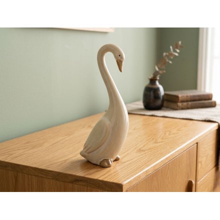 Charming cream resin duck in a poised stance, ideal for enhancing your home decor