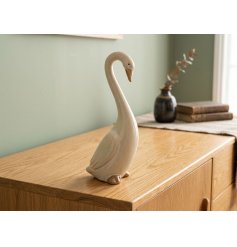 Charming cream resin duck in a poised stance, ideal for enhancing your home decor
