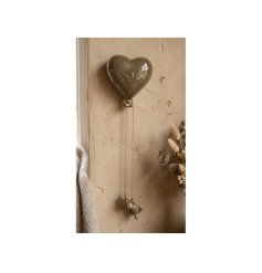 Charming ceramic heart with dangling rabbit, perfect for adding a sweet touch to your wall decor.