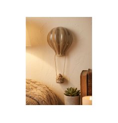Endearing ceramic hedgehog hanging from a balloon, ideal for adding whimsical charm to your walls
