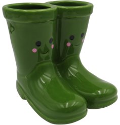 Whimsical welly boot planter with a cheerful smiley face design