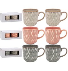 Enhance your modern coffee moments with our embossed stoneware mug trio