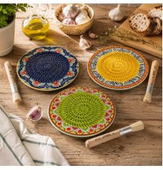 Colourful ceramic plates inspired by Tuscany, ideal for presenting garlic dishes elegantly