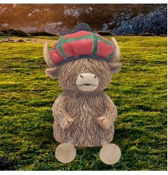 Charming Highland Cow money bank wrapped in classic tartan to save in style