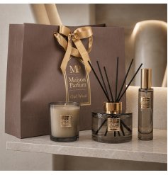 Luxurious Oud Wood set including diffuser, candle, perfume spray, and an elegant carrying bag