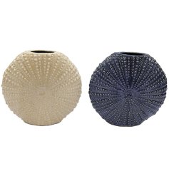 An elegant, textured vase inspired by ocean shells, ideal for enhancing coastal decor