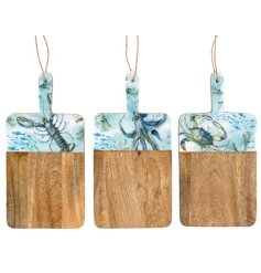 Set of three mango wood chopping boards adorned with charming coastal enamel designs