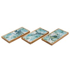 Elegantly crafted trays reflecting the serene hues and flow of the sea
