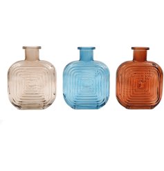Elegant glass vase in a distinctive potion shape, perfect for adding a pop of colour to any space